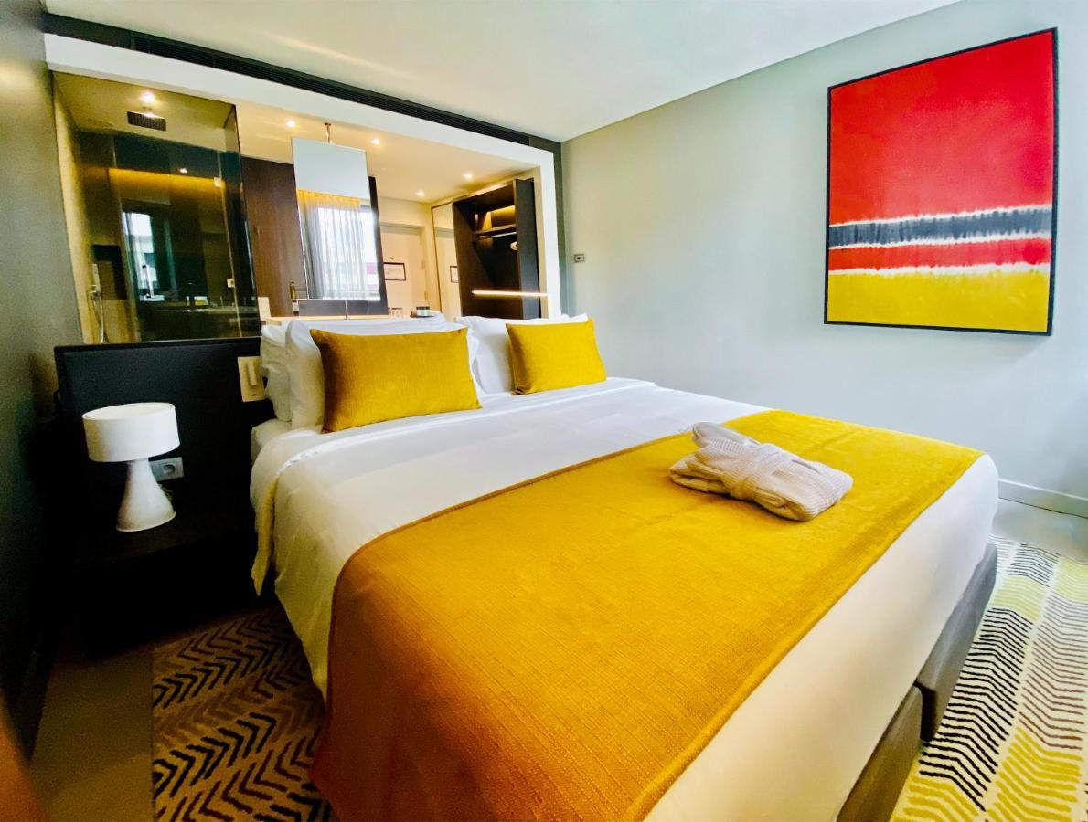 Noom Hotel Abidjan Plateau Εξωτερικό φωτογραφία A bedroom at the hotel
